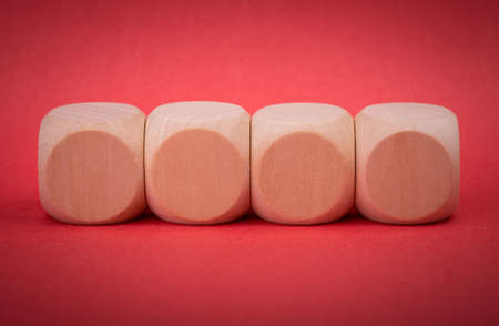 Four blank wooden blocks isolated on color background.の写真素材