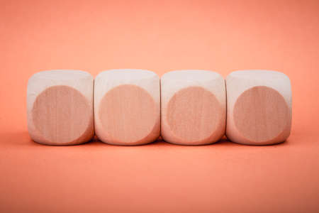 Four blank wooden blocks isolated on color background.の写真素材