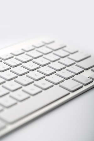 Closeup shot of white keyboard on white background.の写真素材