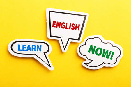 Learn English speech bubble isolated on the yellow background.の写真素材
