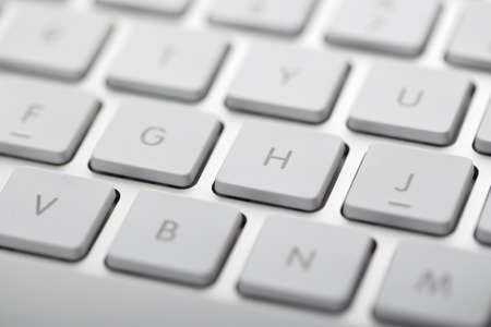 Closeup shot of white keyboard on white background.の写真素材