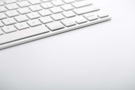 Closeup shot of white keyboard on white background.の写真素材