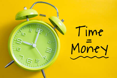 Time is money concept with alarm clock aside.の写真素材