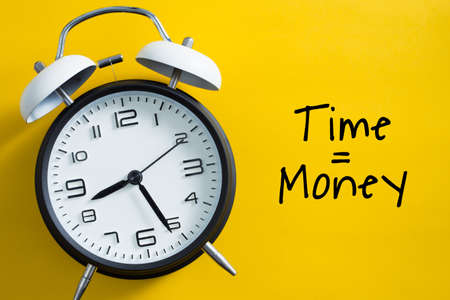 Time is money concept with alarm clock aside.の写真素材