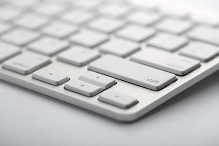 Closeup shot of white keyboard on white background.の写真素材