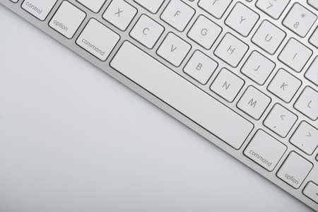 Closeup shot of white keyboard on white background.の写真素材