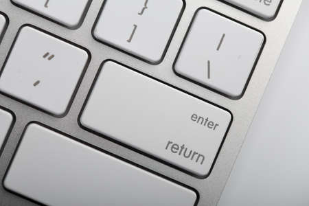 Closeup shot of white keyboard on white background.の写真素材