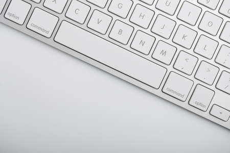 Closeup shot of white keyboard on white background.の写真素材