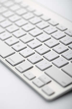 Closeup shot of white keyboard on white background.の写真素材