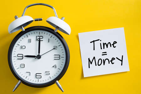 Time is money concept with alarm clock aside.の写真素材