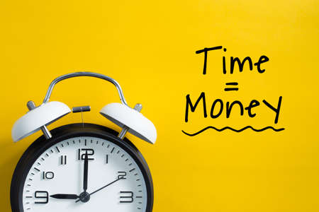 Time is money concept with alarm clock aside.の写真素材