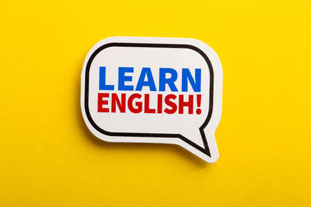 Learn English speech bubble isolated on the yellow background.の写真素材
