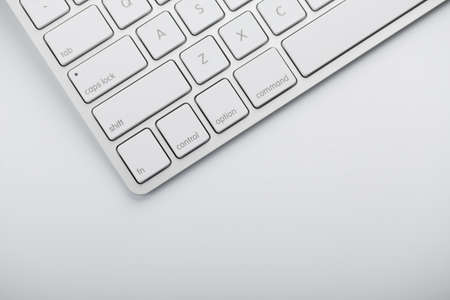 Closeup shot of white keyboard on white background.の写真素材