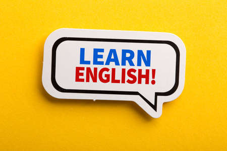 Learn English speech bubble isolated on the yellow background.の写真素材