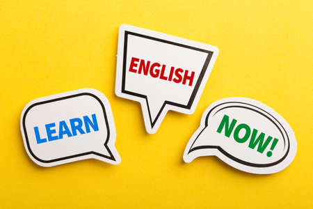 Learn English speech bubble isolated on the yellow background.の写真素材