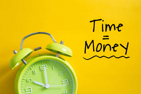 Time is money concept with alarm clock aside.の写真素材