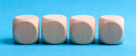 Four blank wooden blocks isolated on color background.の写真素材