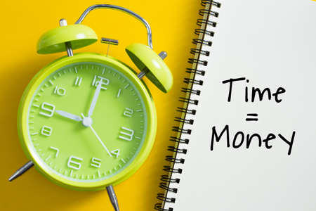 Time is money concept with alarm clock aside.の写真素材
