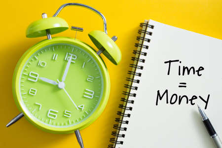 Time is money concept with alarm clock aside.の写真素材
