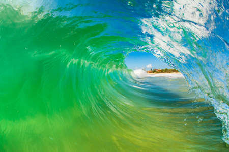 Water shot of wave breaking in crystal clear waters at Campeche beach in Florianopolis Brazilの写真素材