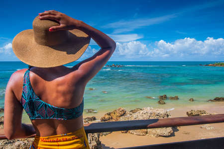 Girl look at the beach at Morro de Sao Paulo in Bahia Brazilの写真素材
