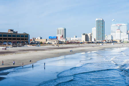 Beach in Atlantic City, New Jersey with boardwalk in backgroundのeditorial素材