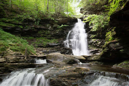 Scenic Waterfall in Ricketts Glen State Park in The Poconos in Pennsylvaniaの写真素材