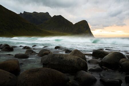 Dramatic waves at sunset at unstad beach on lofoten islands norwayの写真素材