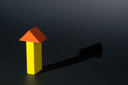 Yellow and Orange Arrow on Black with shadowの写真素材