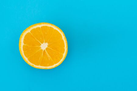 Juicy ripe lemon citrus on blue backgroundの写真素材