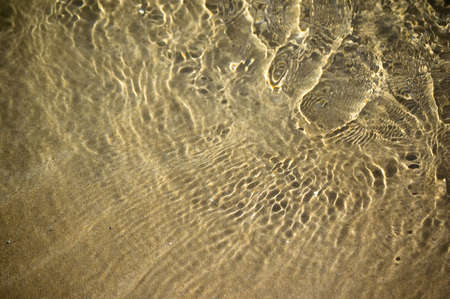 water rippling over sand