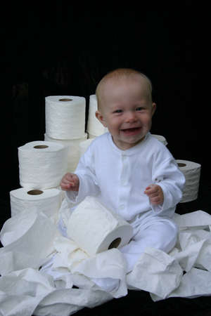 Baby in middle of toilet paper