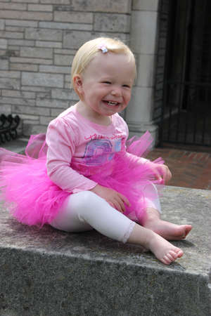 Little girl in tutu smilingの写真素材