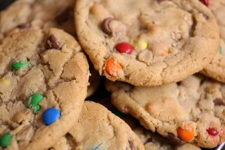 A close up on fresh baked colorful chocolate chip candy cookies.