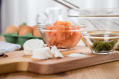 Ingredients for smoked salmon Scrambled eggs with goat's cheese and dillの写真素材