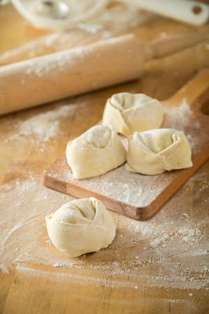 Handmade Italian tortelloni pasta with fillingの写真素材