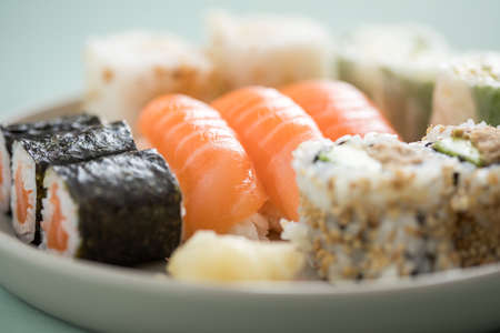 Salmon and tuna sushi with Nigiri, Maki and inside California rollsの写真素材