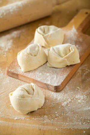 Handmade Italian tortelloni pasta with fillingの写真素材