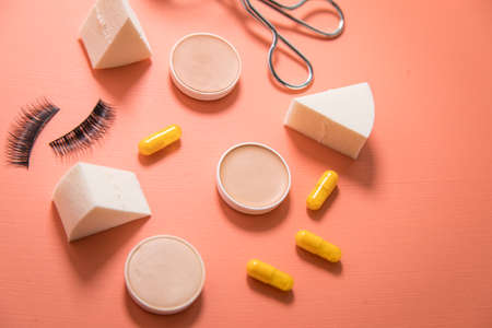 Make up tools sponge, beauty pills, camouflage pans, lash curler and false lashesの写真素材