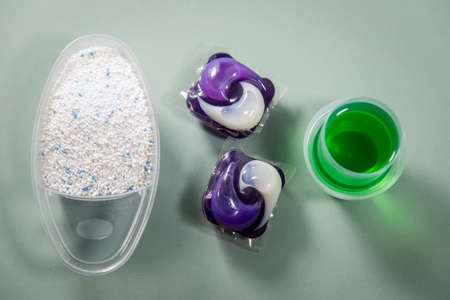 Laundry detergent sorts variety in powder, liquid gel and pod in washing doseの写真素材