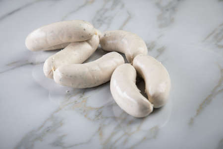 Raw German Bavarian Weisswurst sausage white sausage on marble backgroundの写真素材