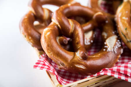 German soft Brezel pretzel with salt in bread basketの写真素材