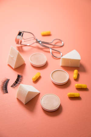 Make up tools sponge, beauty pills, camouflage pans, lash curler and false lashesの写真素材