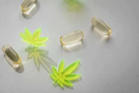 Pills, tablets,  capsules of cannabis marijuana hemp and CBD as pain killer and medical therapyの写真素材