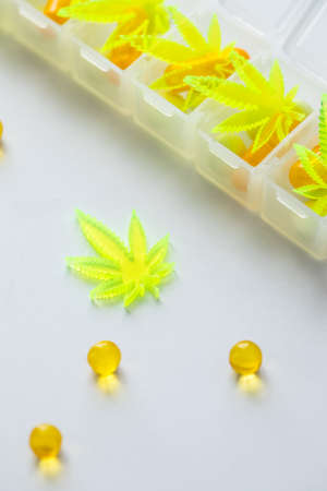 Pills, tablets,  capsules of cannabis marijuana hemp and CBD as pain killer and medical therapy in...