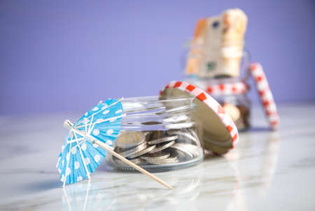 3 glass jars with Euro notes, sunshade, 2â‚¬ coins and loose cash for housekeeping and vacation...