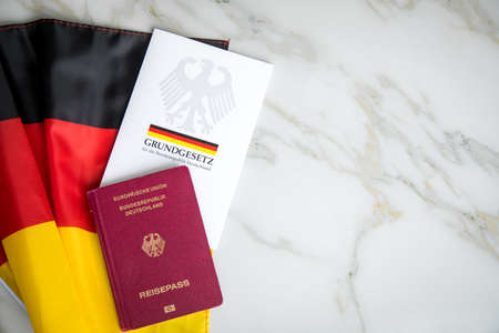 Passport and  constitution basic law book of Germany with flag on marble backgroundのeditorial素材