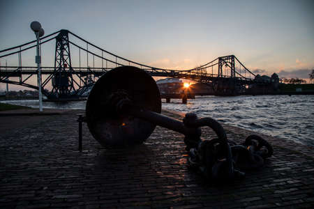 Kaiser-Wilhelm-Bridge a rotatable steel car bridge and landmark in Wilhelmshaven Germany during sunriseのeditorial素材
