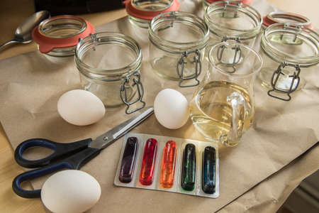 Bright Easter cold color color dye in red, orange, yellow, green, blue in packaging on paper...