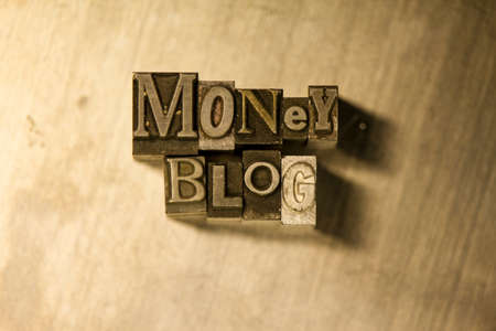 Lead metal "Money blog" typography text on wooden backgroundの写真素材